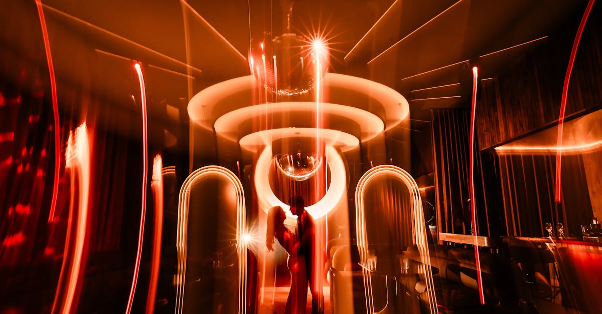 Couple silhouetted against dynamic lights in a glamorous nightclub, creating a romantic and vibrant ambiance.